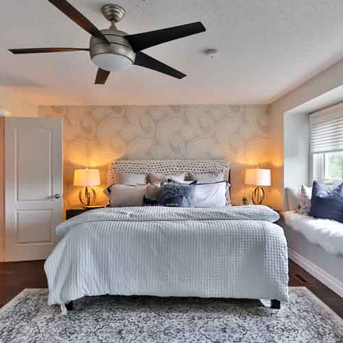 Image of ceiling fan in bedroom.